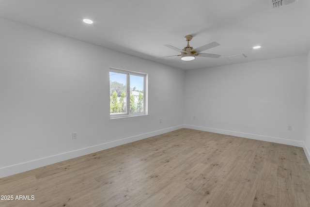 empty room featuring baseboards, recessed lighting, ceiling fan, and light wood-style floors