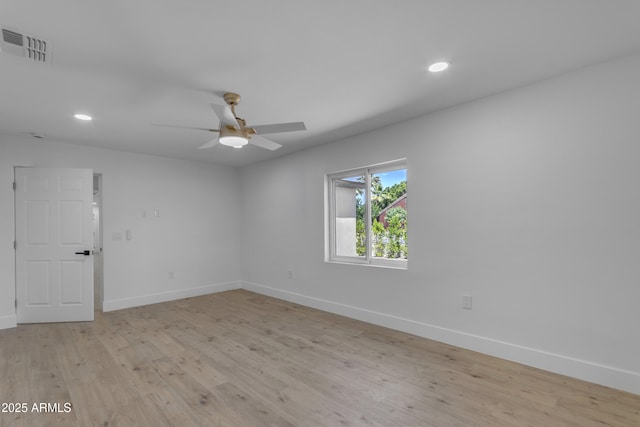 unfurnished room featuring baseboards, recessed lighting, and light wood finished floors