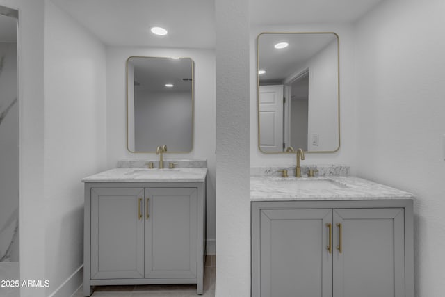 bathroom with two vanities and recessed lighting