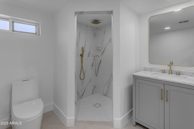 full bath with a marble finish shower, vanity, toilet, and baseboards