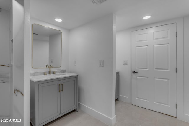 bathroom featuring baseboards, recessed lighting, vanity, and tile patterned floors