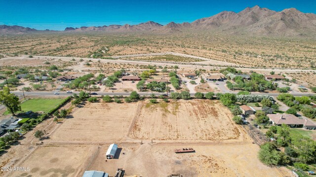 birds eye view of property with a mountain view