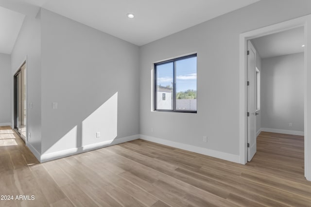 unfurnished room with light hardwood / wood-style floors