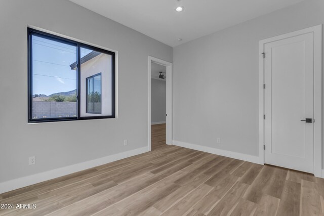 spare room featuring light hardwood / wood-style floors