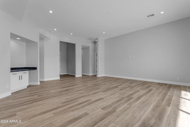 unfurnished living room featuring light hardwood / wood-style flooring