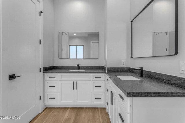 bathroom featuring hardwood / wood-style flooring and vanity