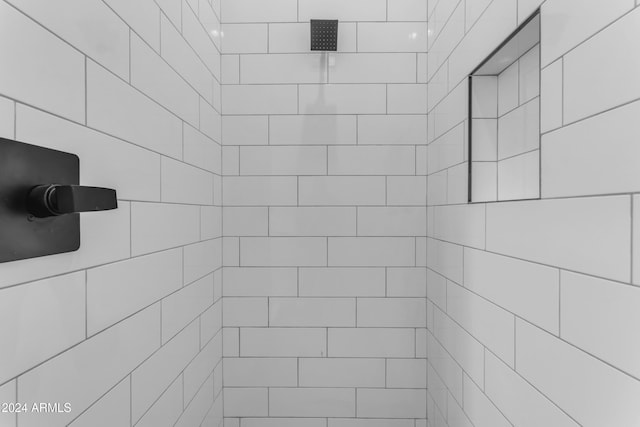 bathroom with a tile shower