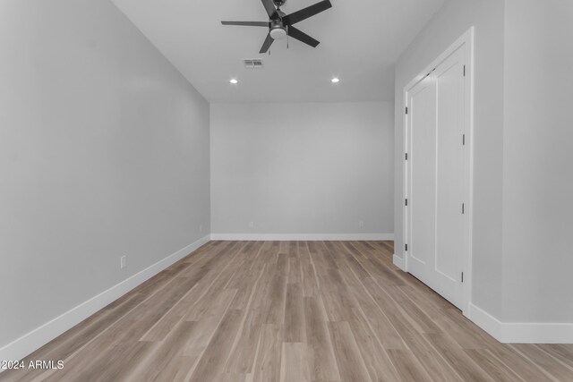 unfurnished room featuring ceiling fan and light hardwood / wood-style flooring