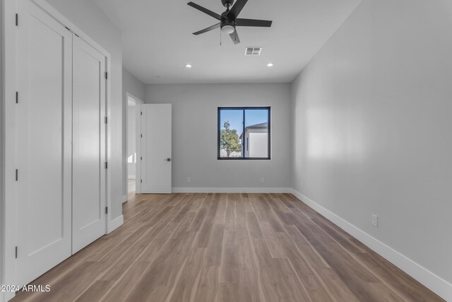 unfurnished bedroom featuring light wood-type flooring