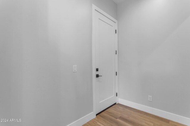 corridor featuring light hardwood / wood-style flooring