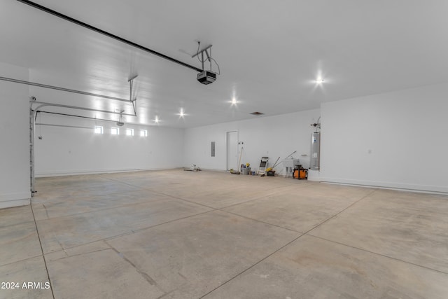 garage featuring a garage door opener and water heater