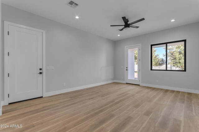 unfurnished room with ceiling fan and light hardwood / wood-style floors