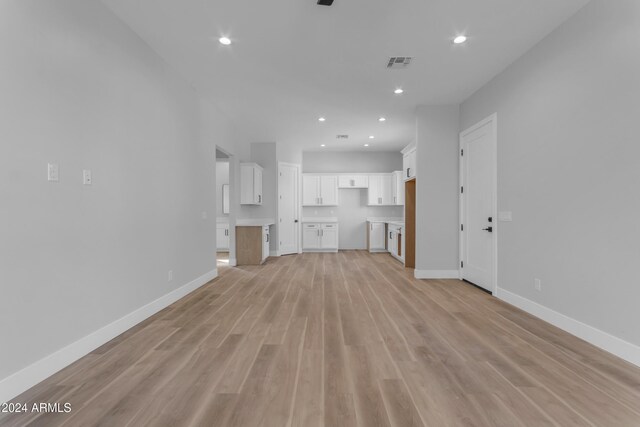 unfurnished living room featuring light hardwood / wood-style floors