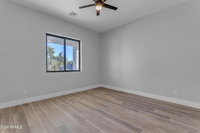 unfurnished room with ceiling fan and light hardwood / wood-style flooring