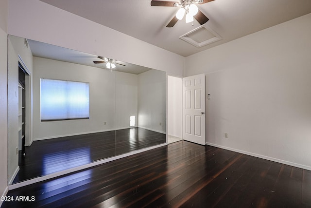 empty room featuring ceiling fan and dark hardwood / wood-style floors