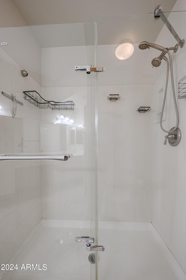 bathroom with a shower with shower door