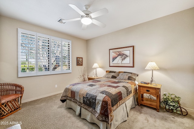 bedroom featuring light colored carpet and ceiling fan