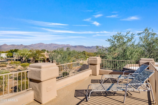 exterior space featuring a mountain view and a balcony