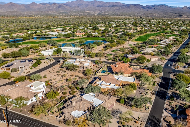 drone / aerial view with a water and mountain view