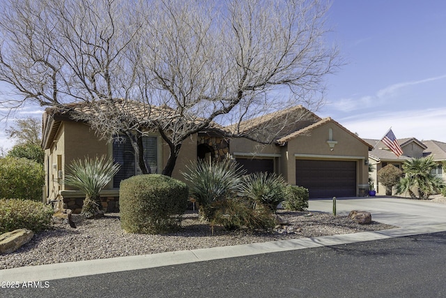 ranch-style house featuring a garage