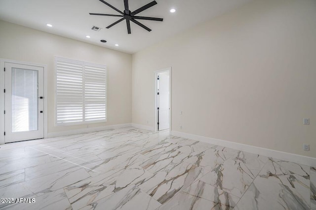 spare room with recessed lighting, a ceiling fan, visible vents, baseboards, and marble finish floor