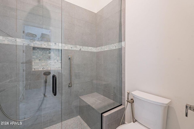 full bath with a shower stall and toilet