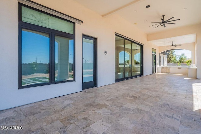 view of patio featuring ceiling fan