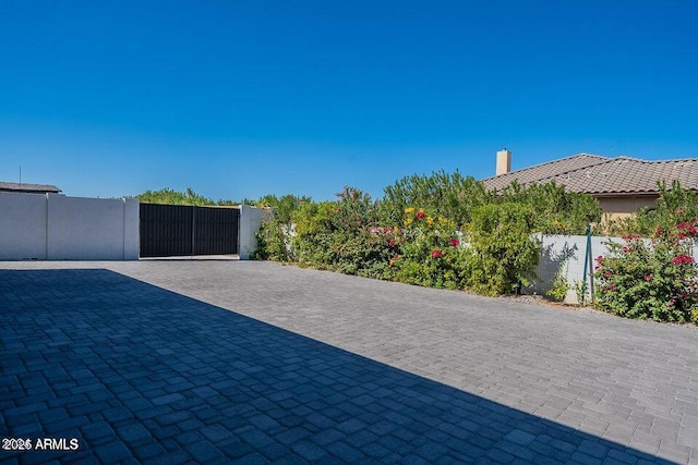 view of patio / terrace featuring a gate and fence