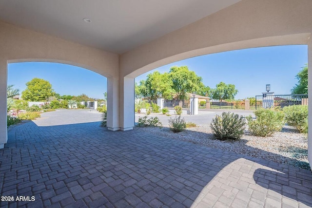 view of patio featuring fence