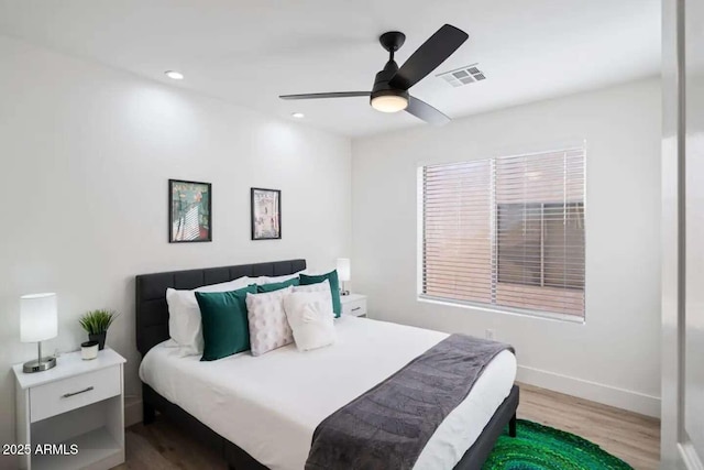 29228 N 48th St, Cave Creek, AZ 85331 - bedroom with ceiling fan, recessed lighting, baseboards, wood finished floors, and visible vents