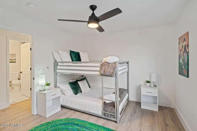 29228 N 48th St, Cave Creek, AZ 85331 - bedroom with baseboards, ceiling fan, and wood finished floors