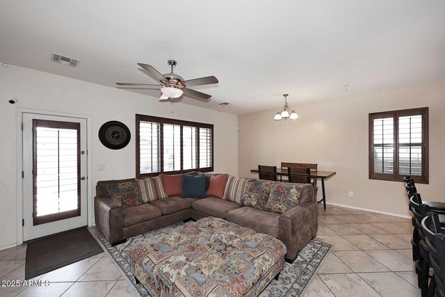 7712 S 37th Way, Phoenix, AZ 85042 - living room with a chandelier, a ceiling fan, healthy amount of natural light, and baseboards