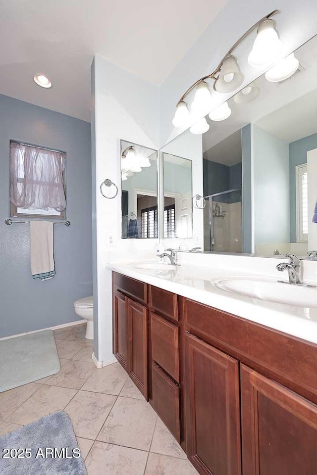7712 S 37th Way, Phoenix, AZ 85042 - full bath featuring a shower stall, double vanity, and toilet