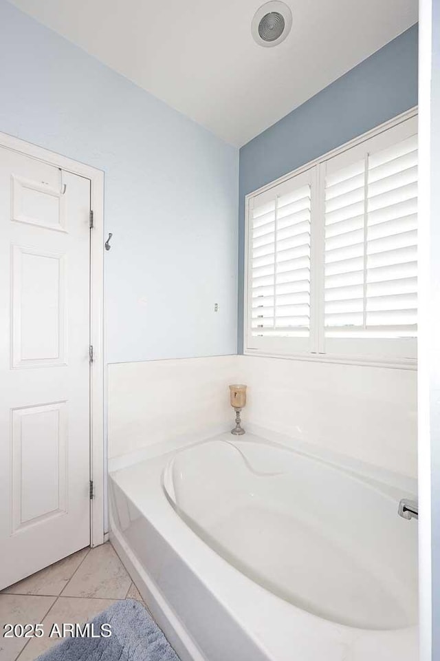 7712 S 37th Way, Phoenix, AZ 85042 - full bathroom featuring a bath and tile patterned flooring