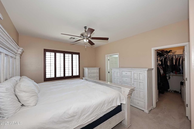 7712 S 37th Way, Phoenix, AZ 85042 - bedroom with a spacious closet, light carpet, a closet, and a ceiling fan