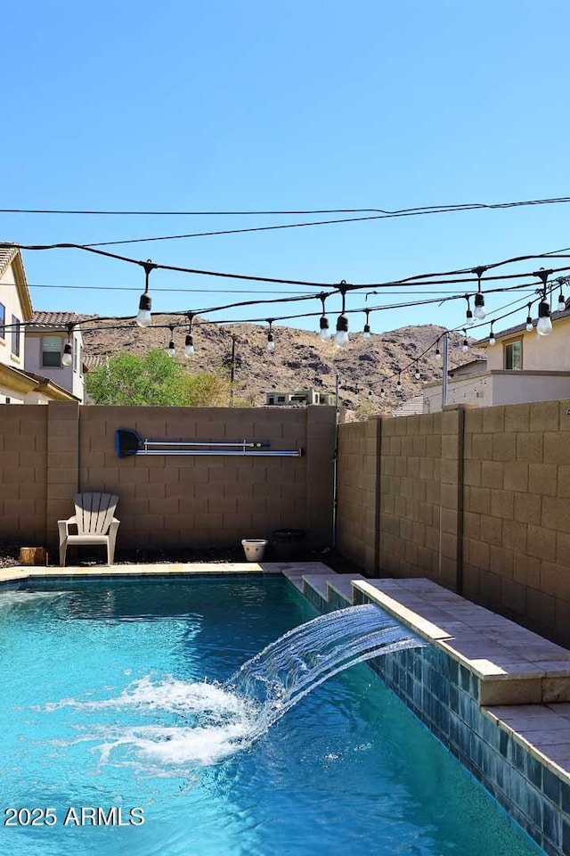 7712 S 37th Way, Phoenix, AZ 85042 - view of swimming pool with a pool with connected hot tub and a fenced backyard