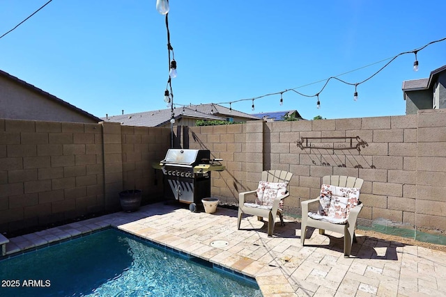 7712 S 37th Way, Phoenix, AZ 85042 - view of swimming pool featuring a grill, a patio area, and a fenced backyard