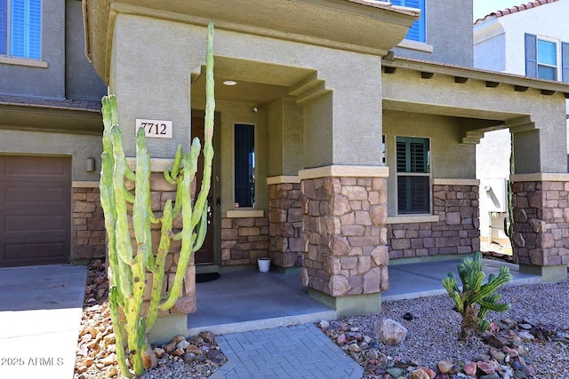 7712 S 37th Way, Phoenix, AZ 85042 - doorway to property with stone siding and stucco siding