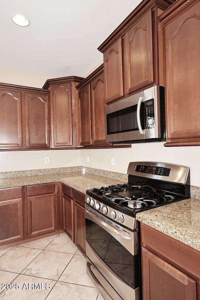 7712 S 37th Way, Phoenix, AZ 85042 - kitchen with appliances with stainless steel finishes, light stone counters, and recessed lighting