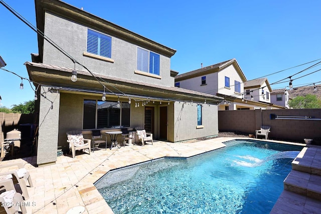 7712 S 37th Way, Phoenix, AZ 85042 - back of house featuring a patio area, a fenced backyard, and stucco siding
