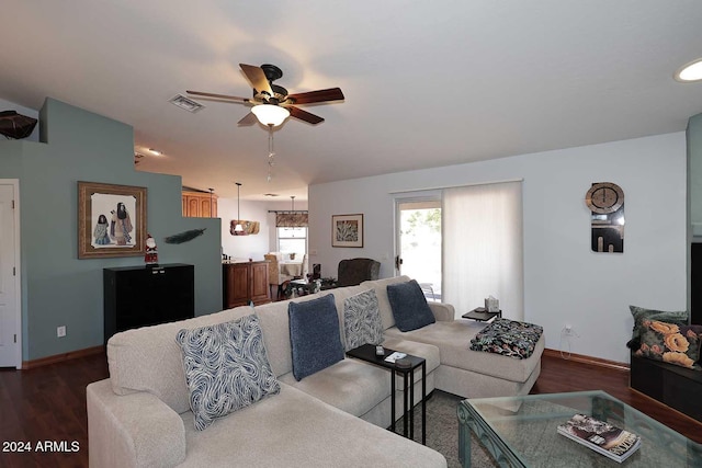 living room featuring hardwood / wood-style flooring and ceiling fan