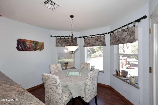 dining space featuring dark hardwood / wood-style floors