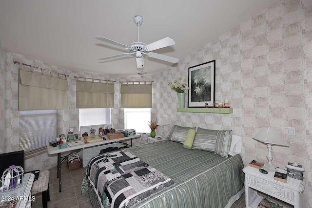 tiled bedroom with ceiling fan