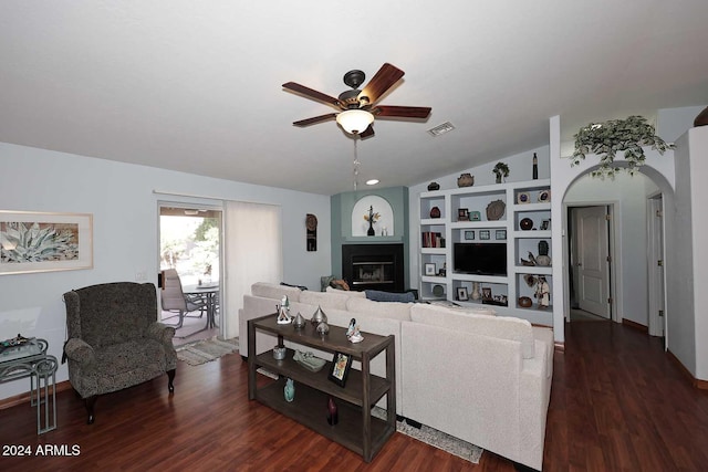 living room with ceiling fan, dark wood-type flooring, and vaulted ceiling