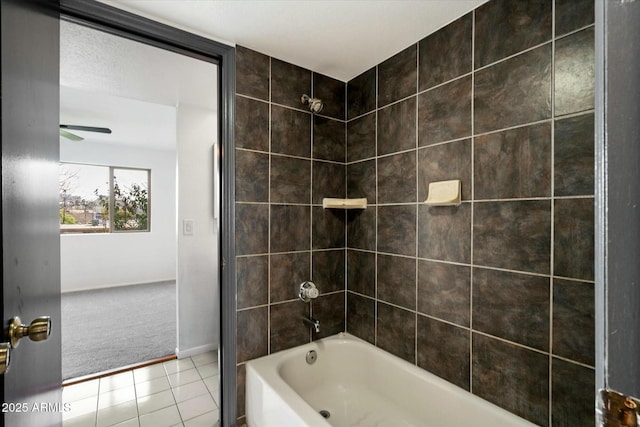 bathroom with ceiling fan, baseboards, shower / tub combination, and tile patterned floors