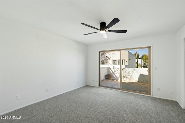 carpeted empty room with a ceiling fan and baseboards