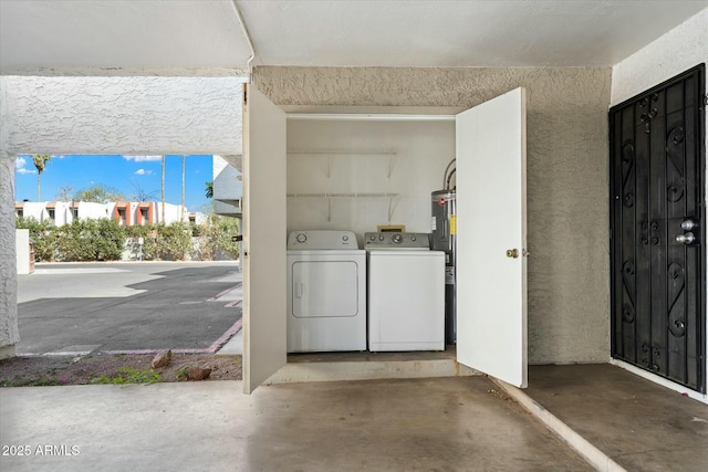 clothes washing area with laundry area and washer and dryer