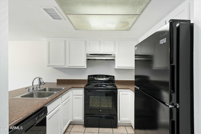 kitchen featuring black appliances, white cabinetry, extractor fan, and a sink