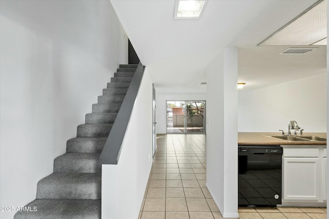 stairs with visible vents and tile patterned floors