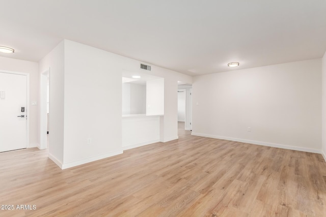 10750 W Abbott Ave, Sun City, AZ 85351 - empty room featuring light wood-type flooring, baseboards, and visible vents